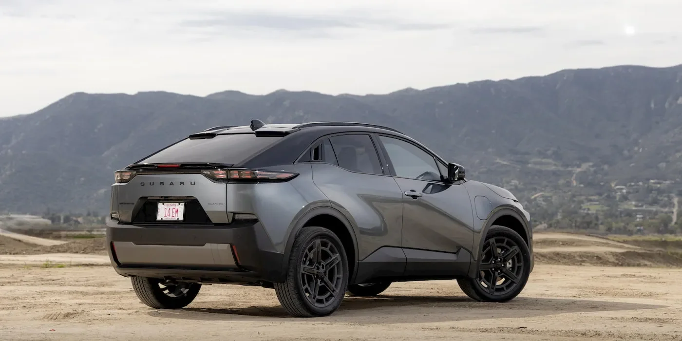 Front profile of the Subaru Uncharted electric SUV parked in a modern neighborhood